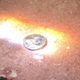 Image for article titled Wind Down Your Day by Watching These Pennies Melt Under the Sun's Intense Heat